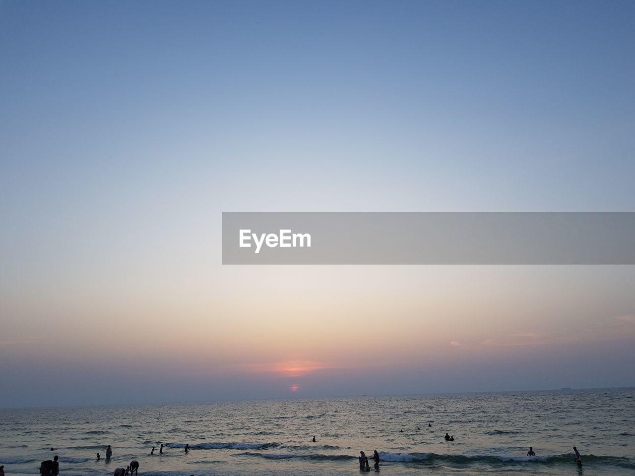 Scenic view of sea against clear sky during sunset