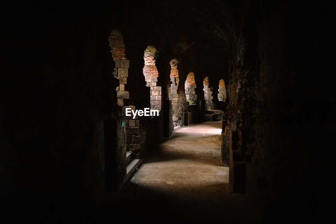 Roman amphitheater arcades of catania illuminated by light