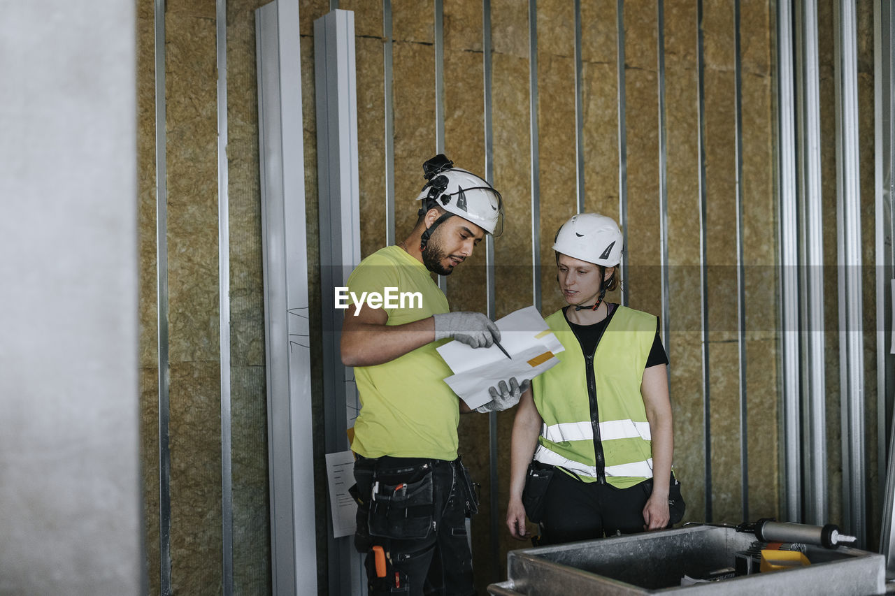 People talking at construction site
