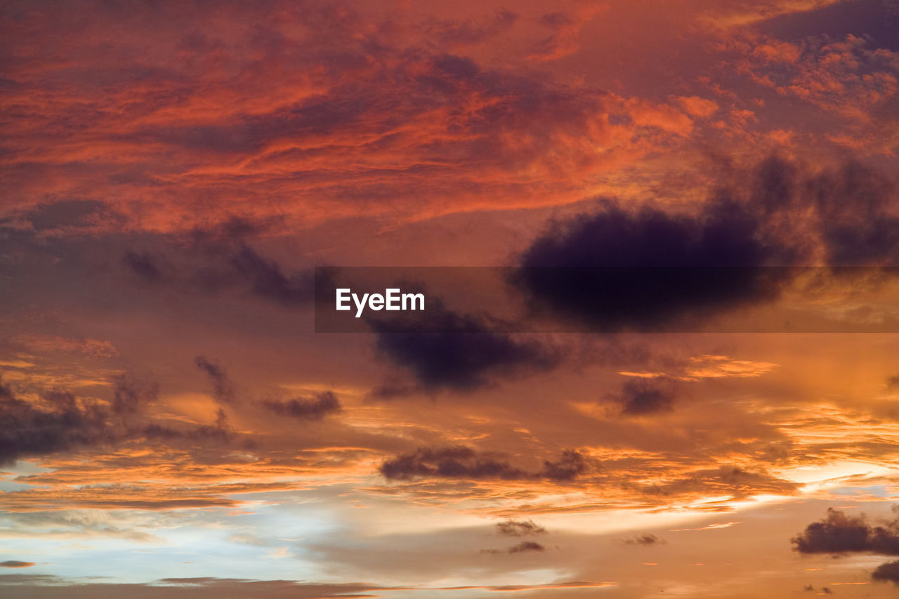 Low angle view of dramatic sky during sunset