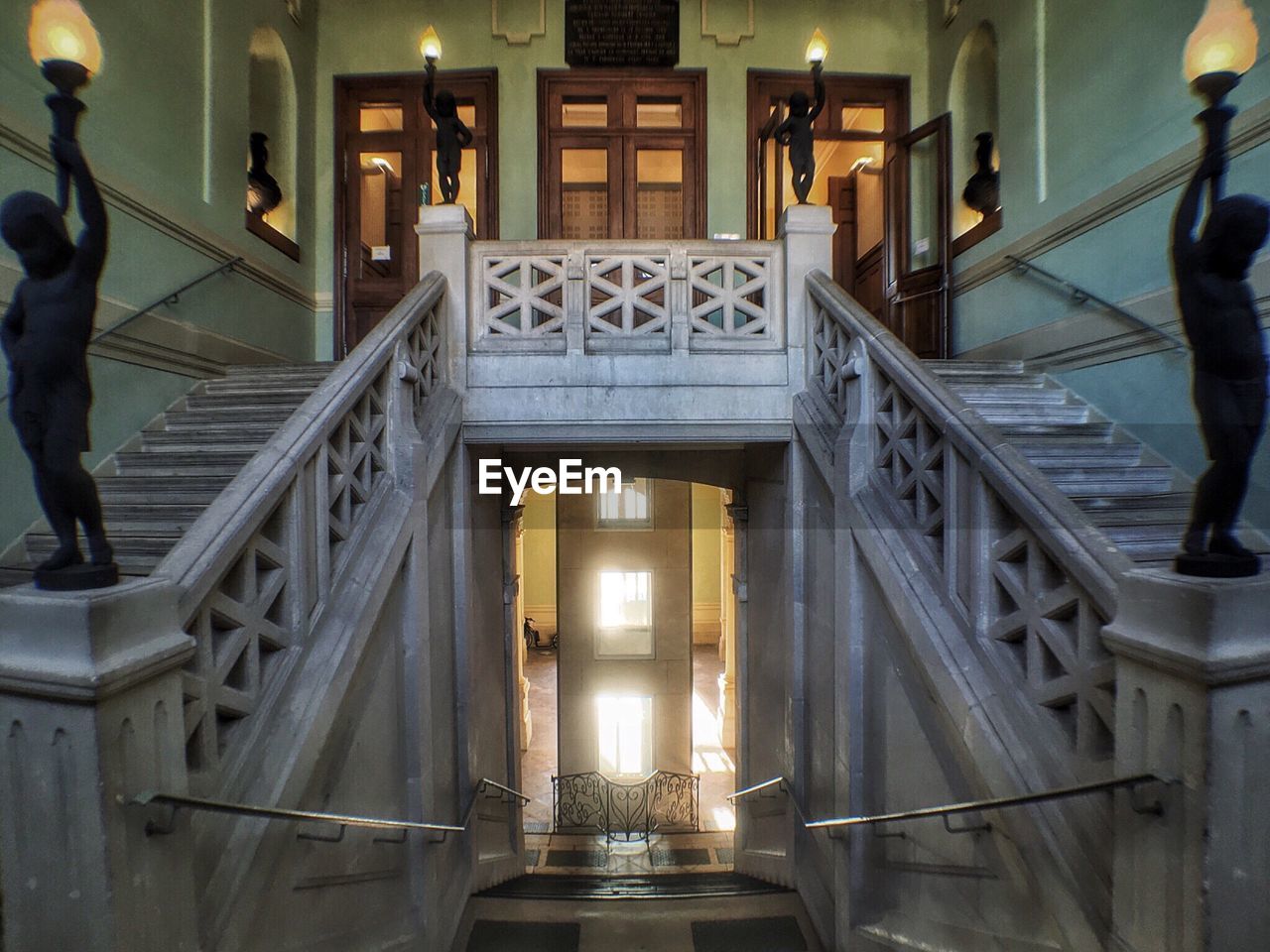 VIEW OF STAIRS IN ILLUMINATED BUILDING