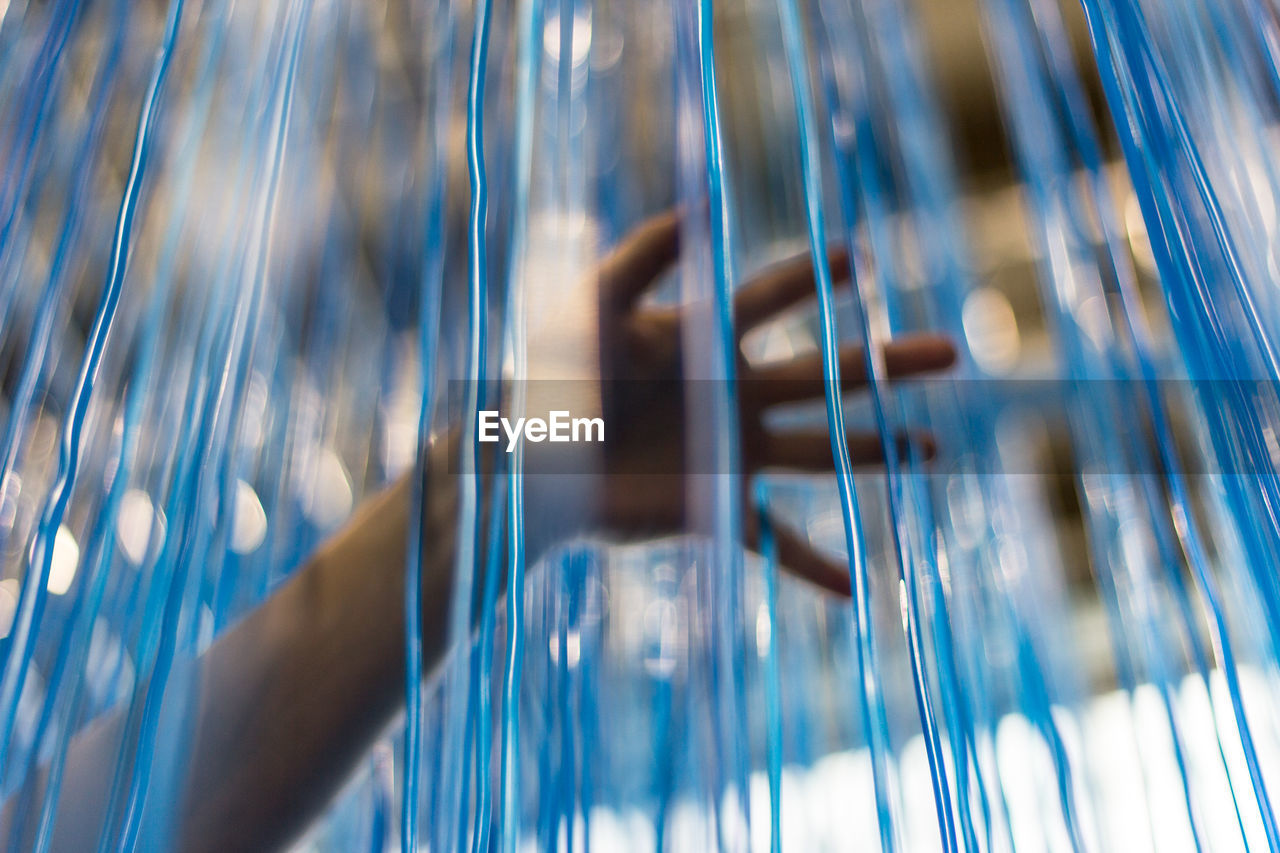 Close-up of man hand holding wire