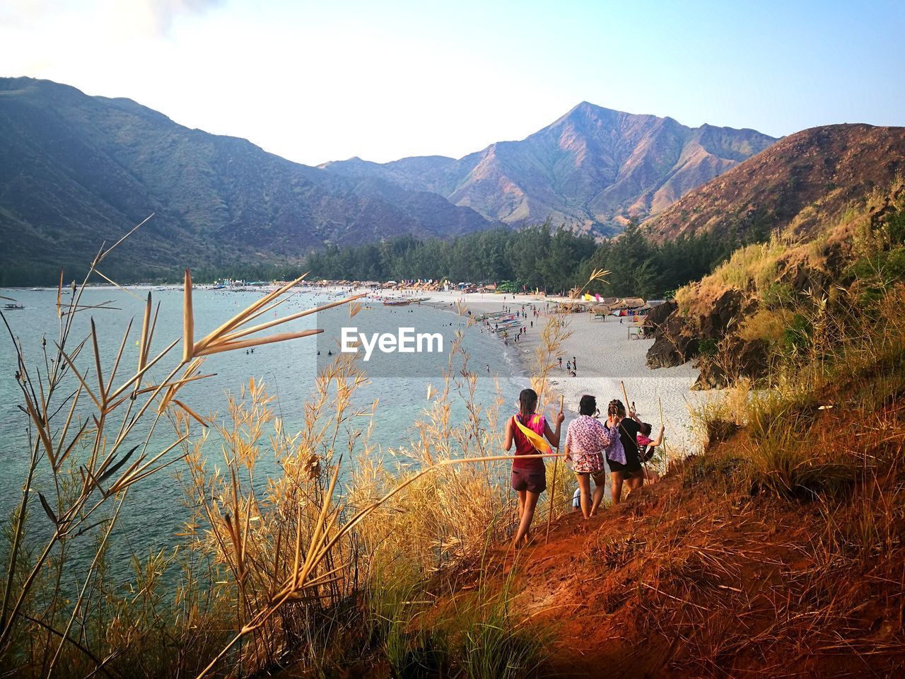 PEOPLE AND MOUNTAINS AGAINST CLEAR SKY