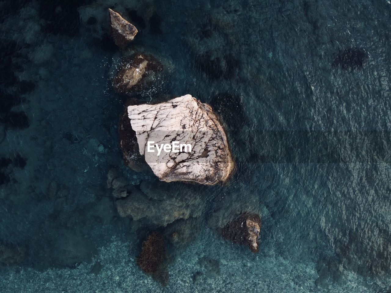 High angle view of rock formation in sea