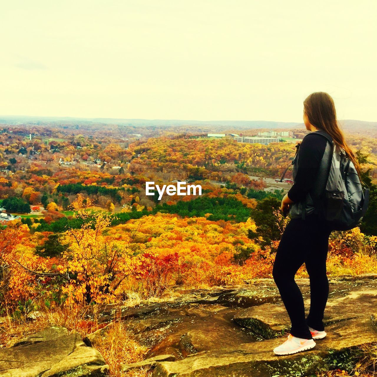 WOMAN STANDING ON LANDSCAPE