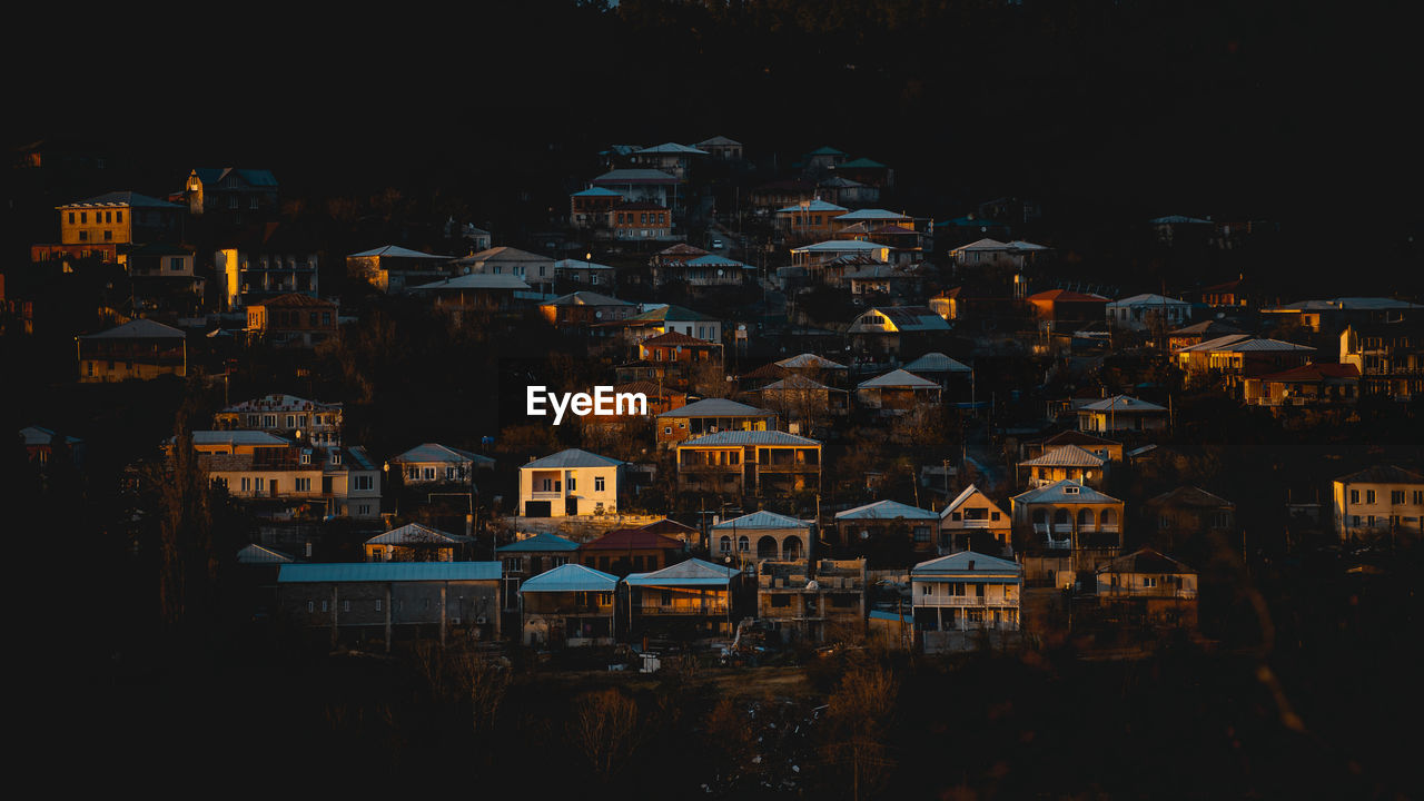 High angle view of illuminated buildings in city