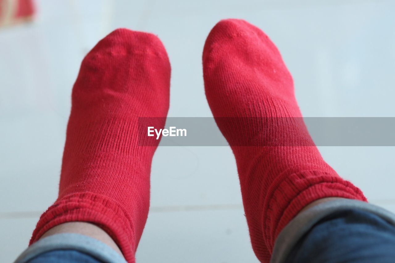 Low section of person wearing red socks