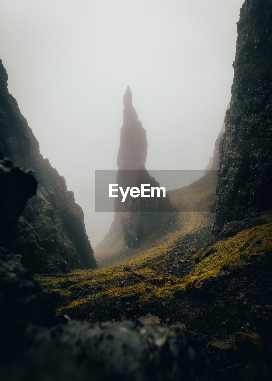 Rear view of woman standing on mountain isle of skye 