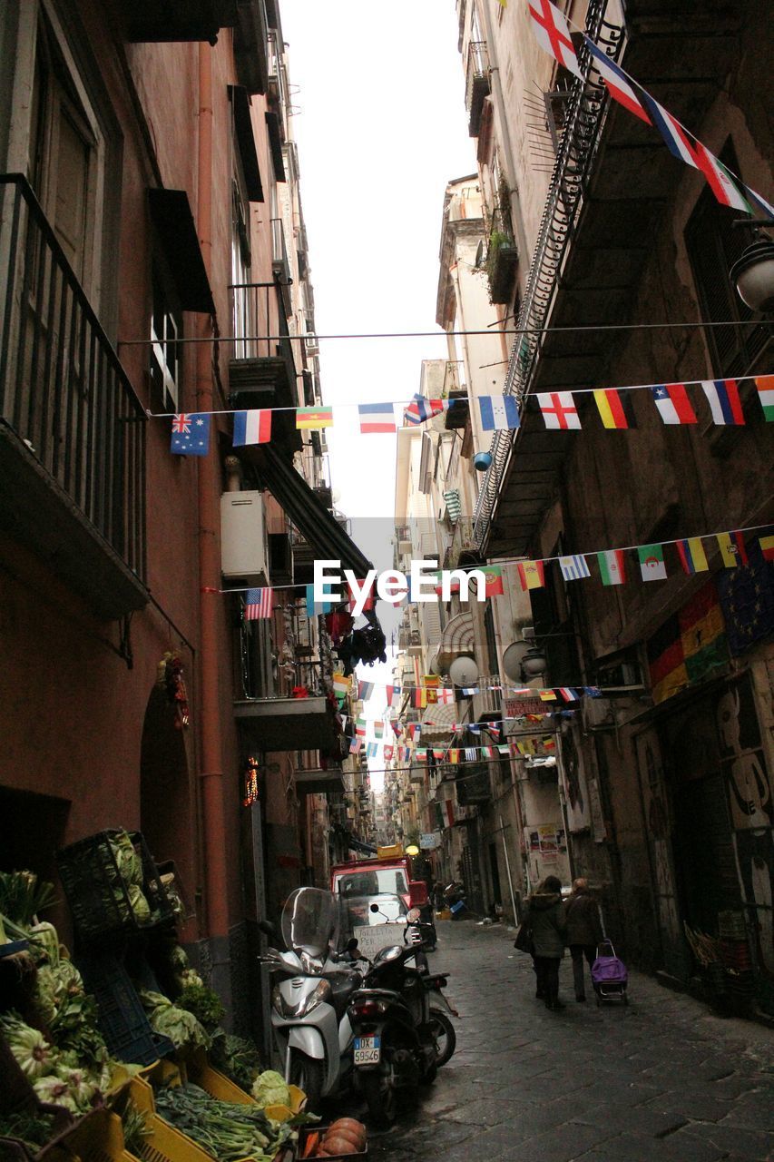 Street amidst buildings against sky