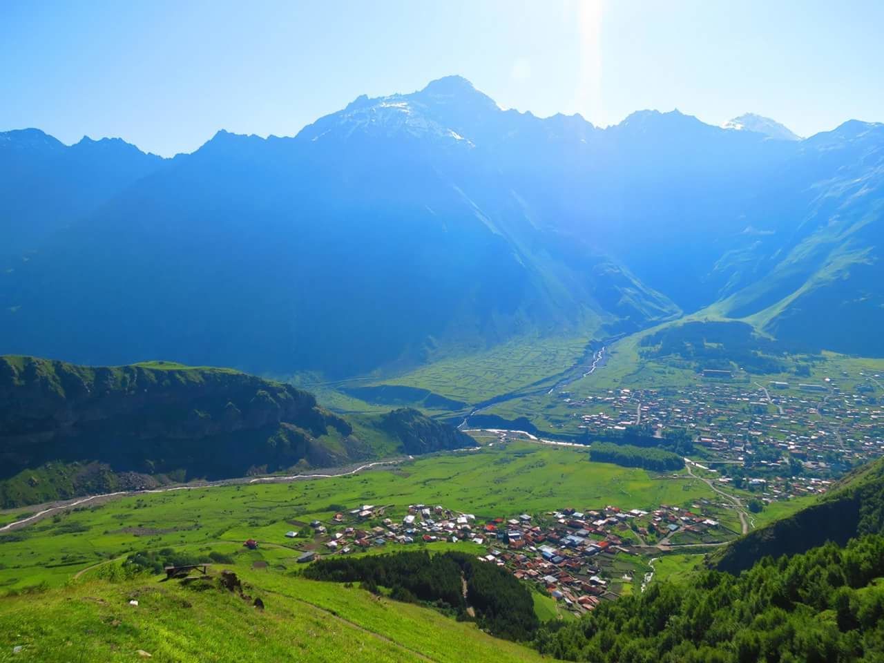 Town amidst scenic view of mountains