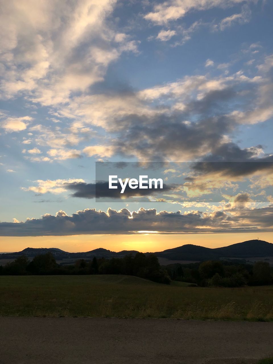 SCENIC VIEW OF SILHOUETTE LAND AGAINST SKY DURING SUNSET