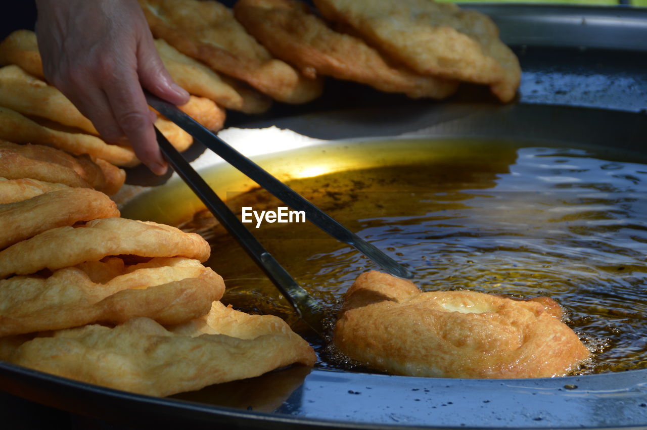 Close-up of man preparing food