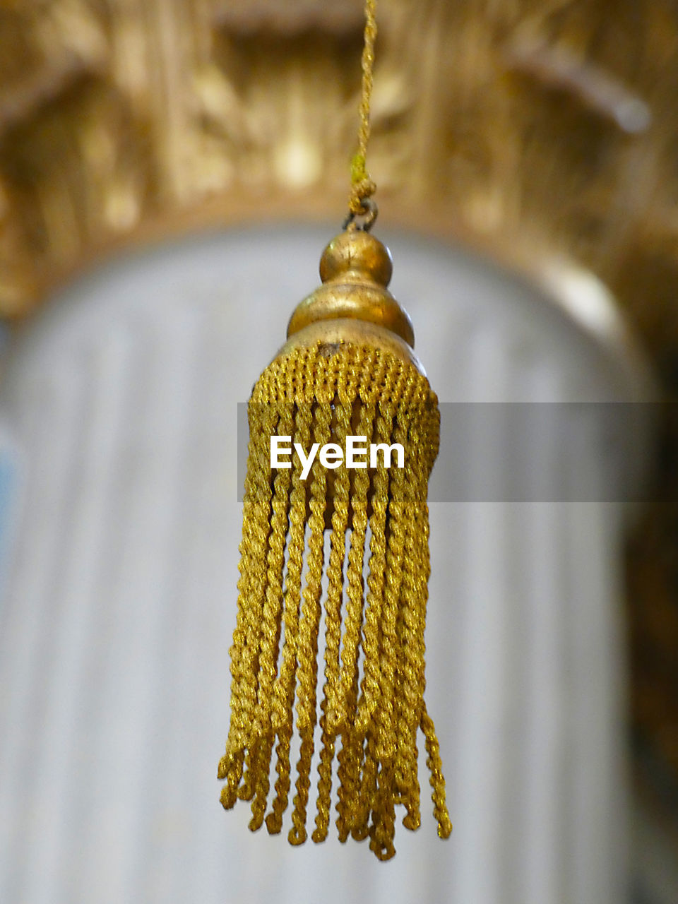 Close-up of yellow decoration hanging on tree