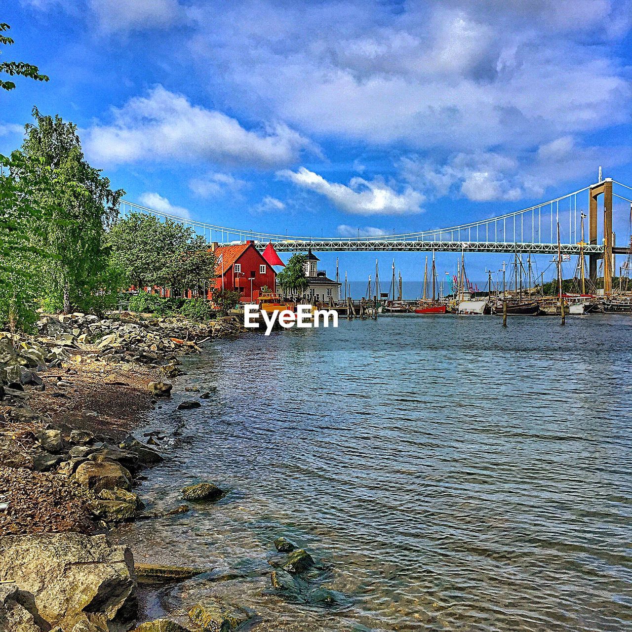 VIEW OF BRIDGE AGAINST CLOUDY SKY