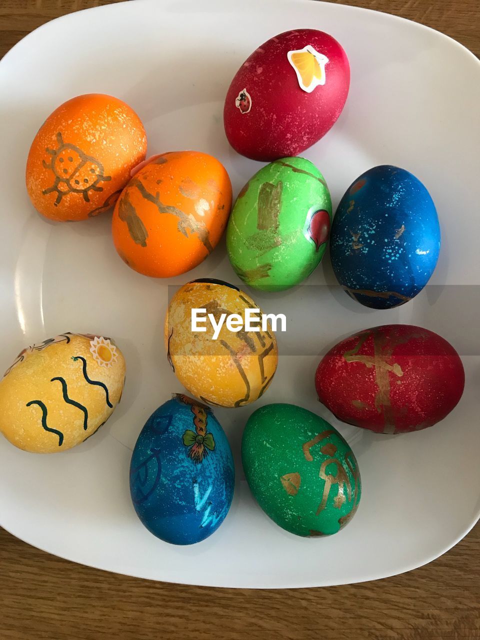 High angle view of multi colored eggs on table