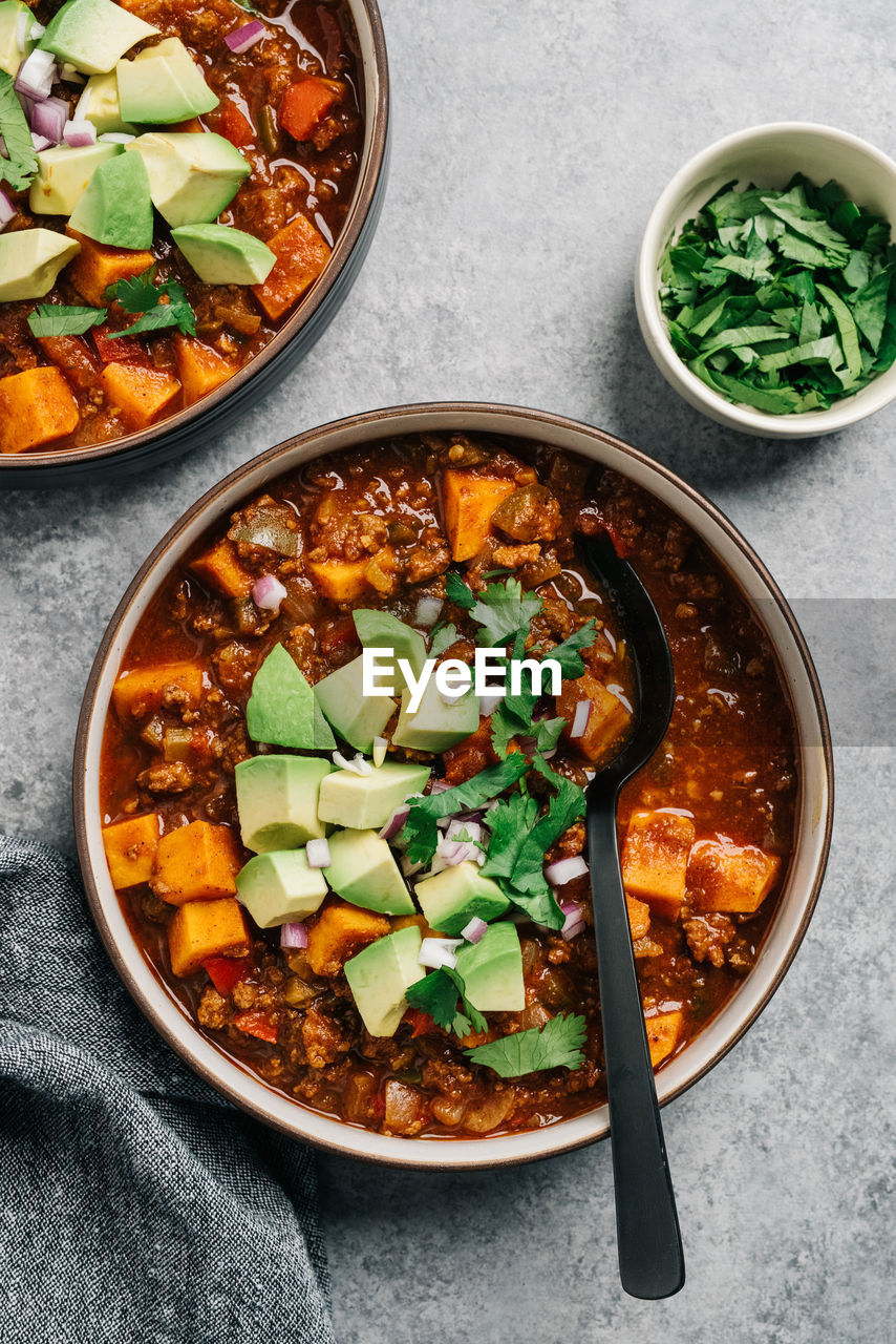 Whole30 paleo chili con carne with sweet potato and fresh avocado