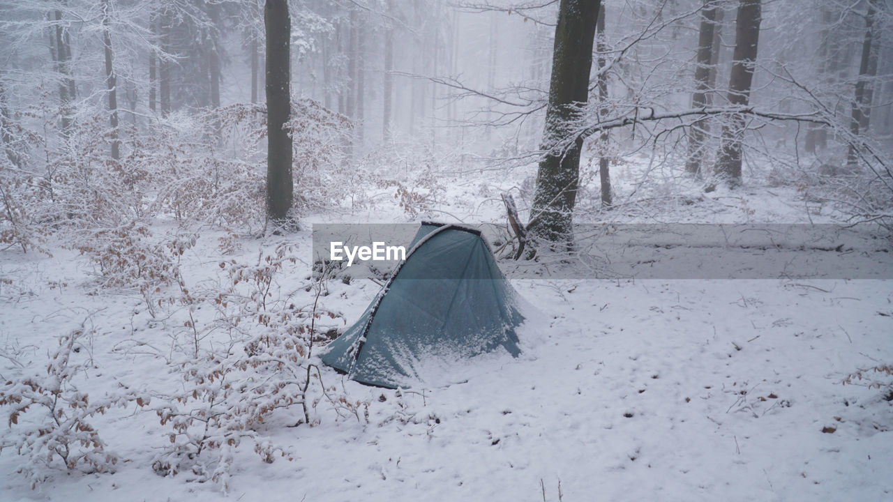 Snow covered tent in the snow 