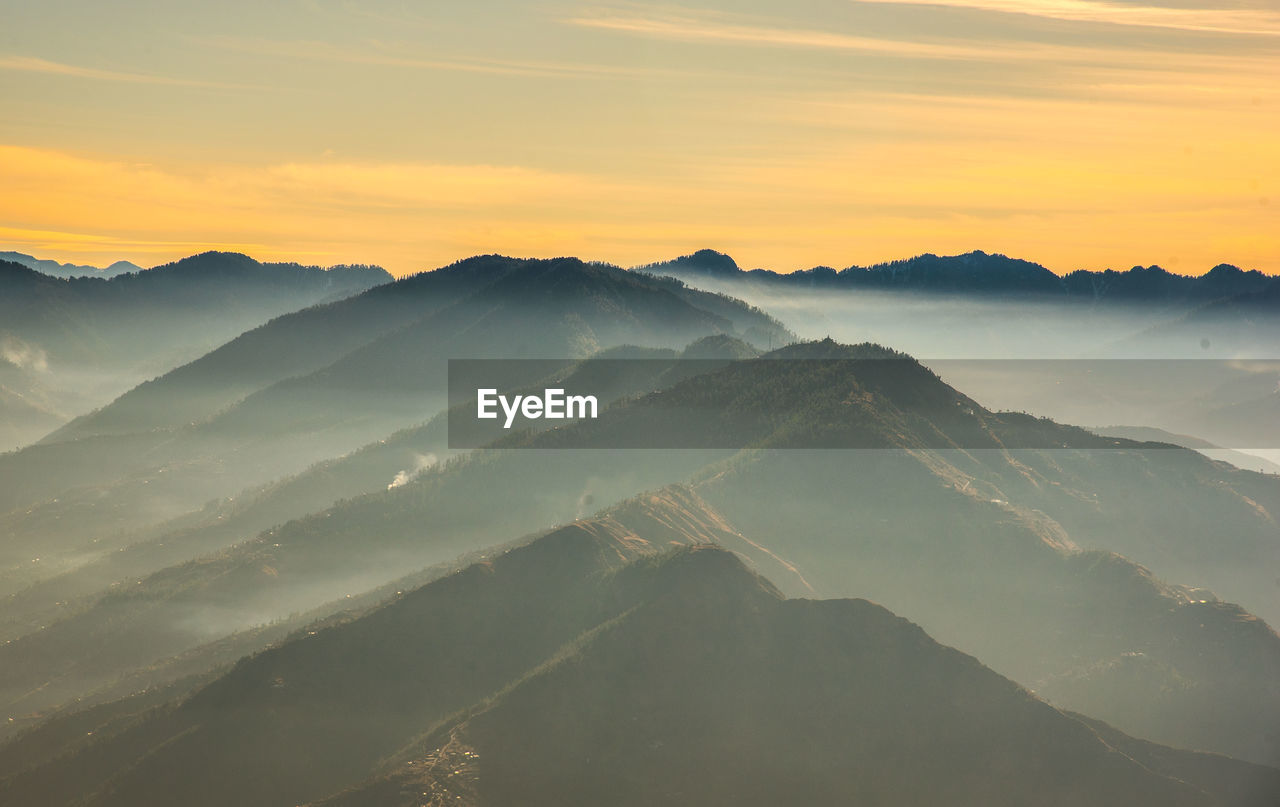 Scenic view of mountains at sunset