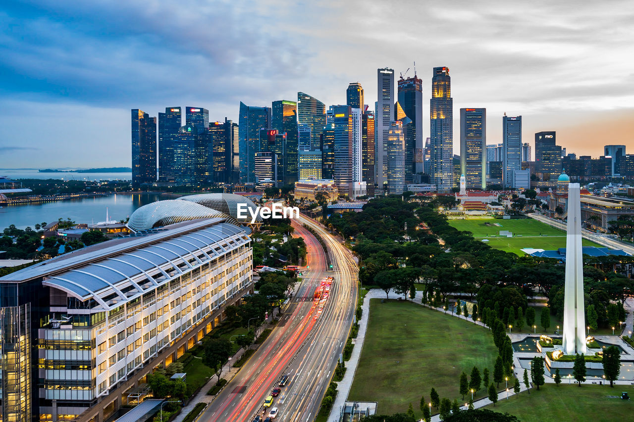 High angle view of road amidst buildings in city against sky