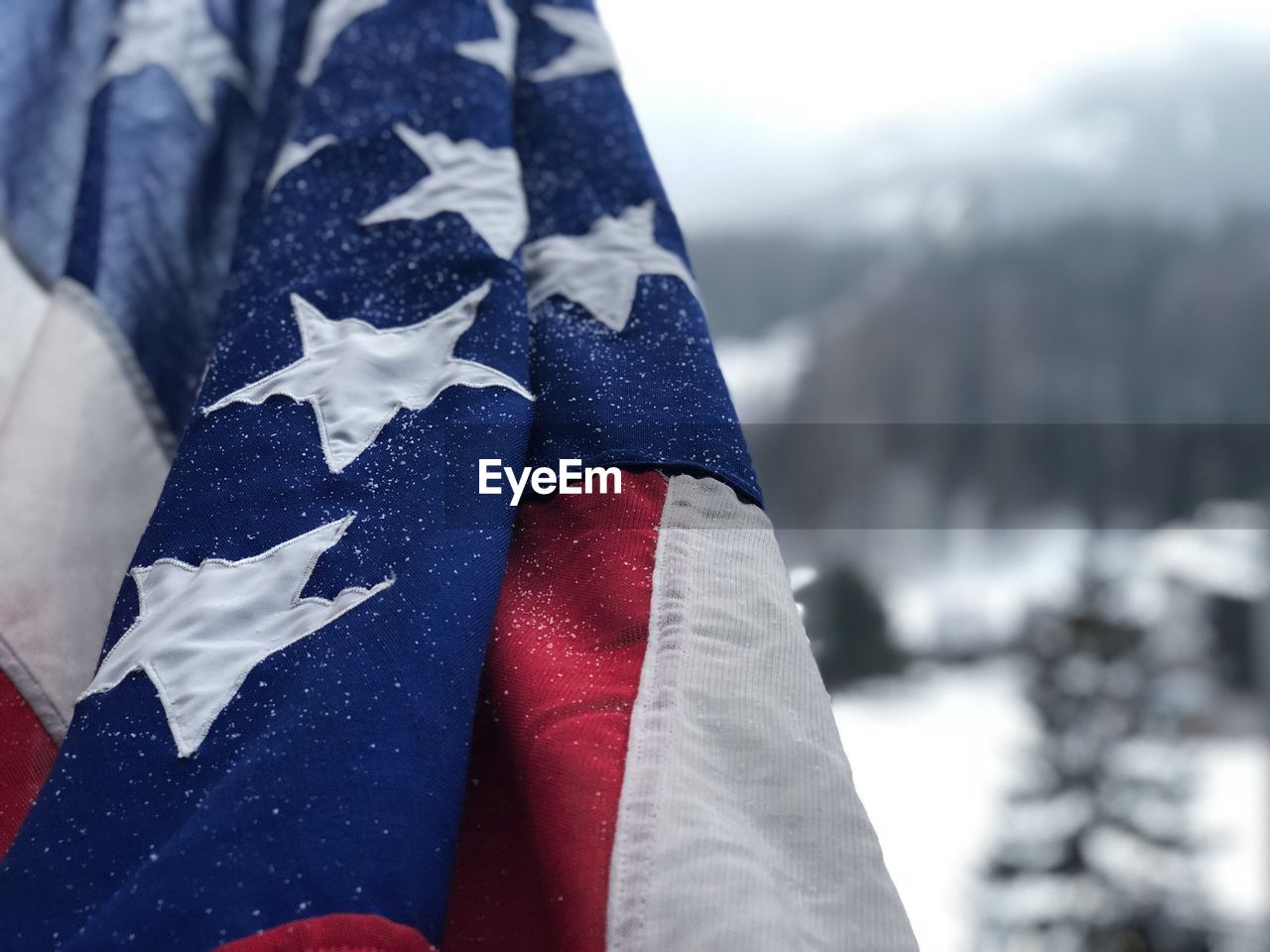 Close-up of flag during snowfall