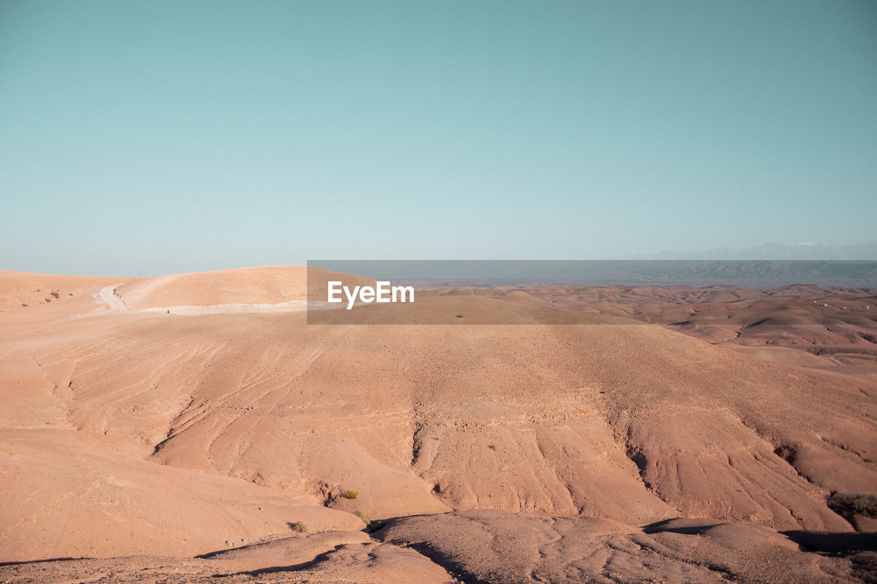 Scenic view of desert against clear sky