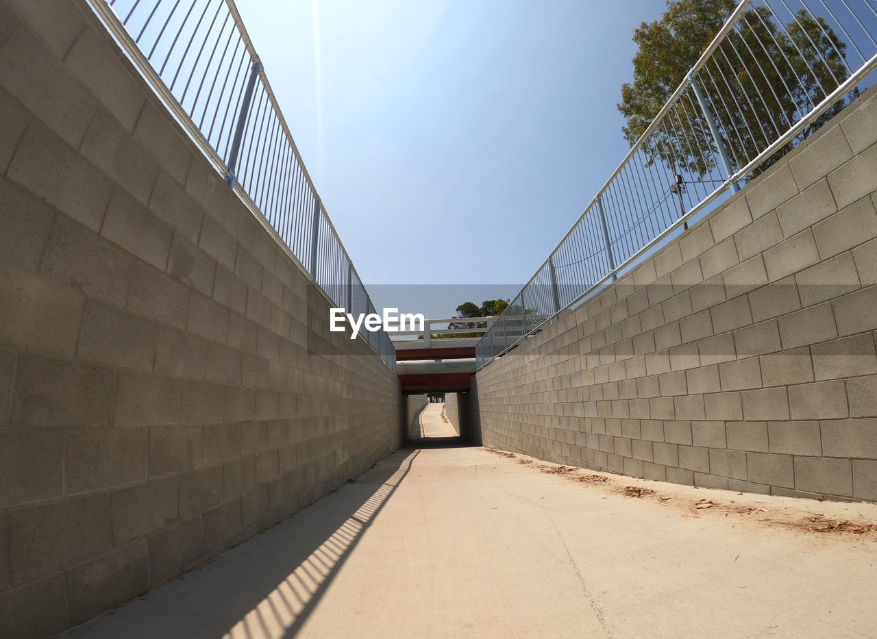 FOOTPATH LEADING TOWARDS BUILDING AGAINST SKY