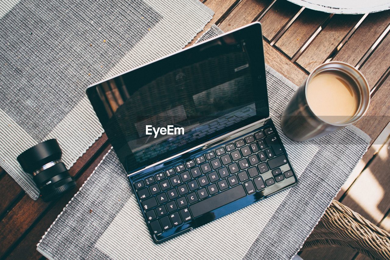 Close-up of open laptop and tea