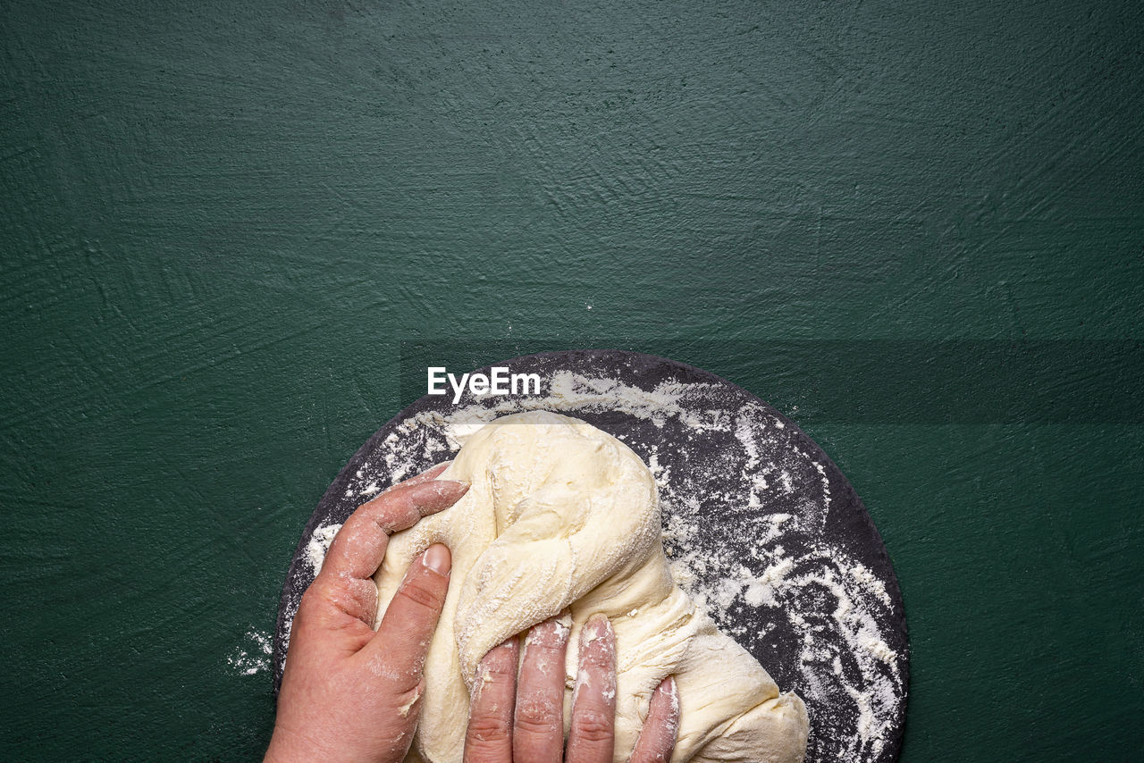 Close-up of person had preparing food