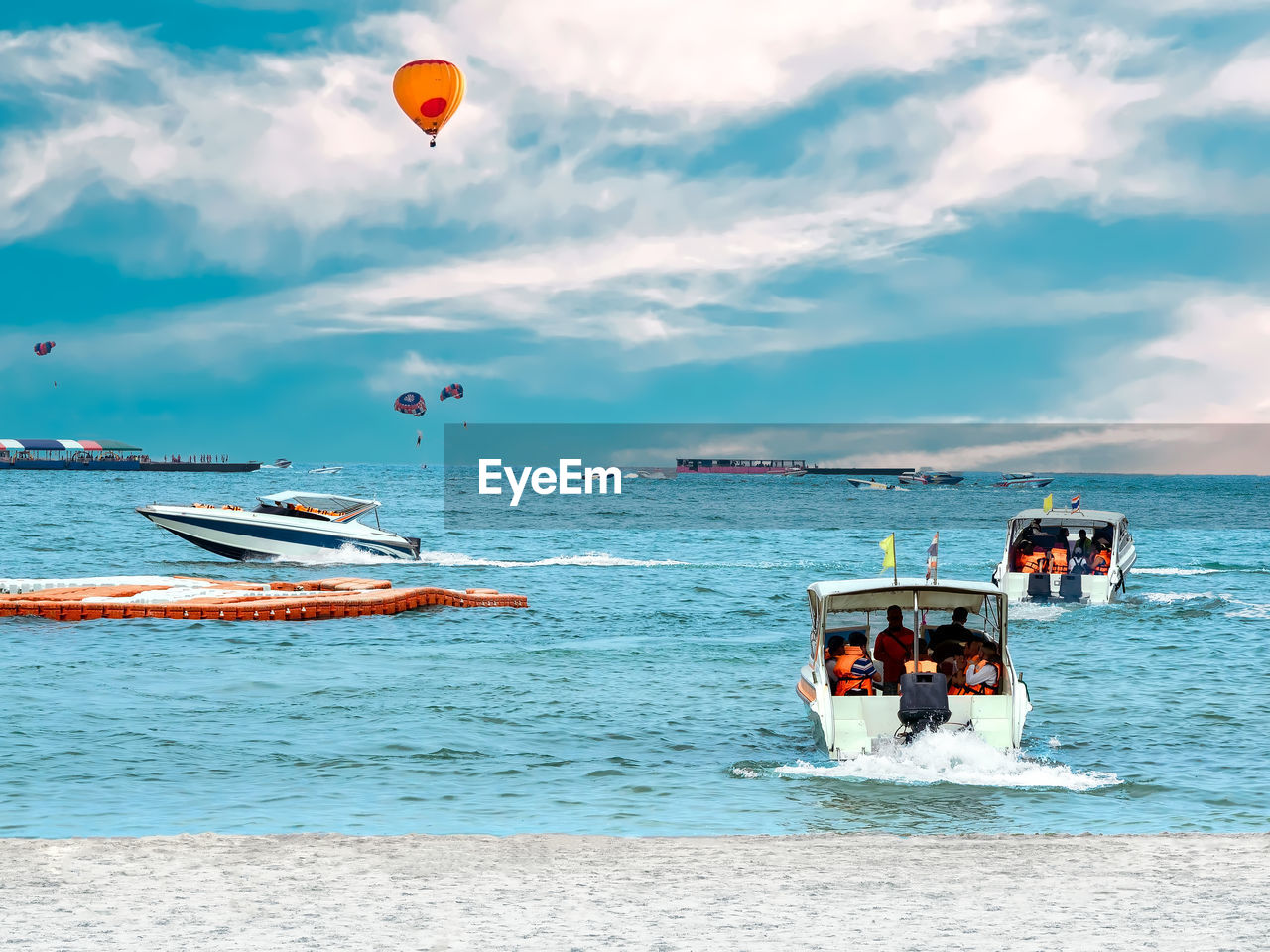 Boats in sea against sky