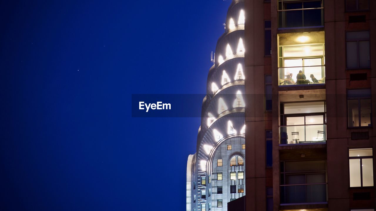 MODERN BUILDING AGAINST BLUE SKY