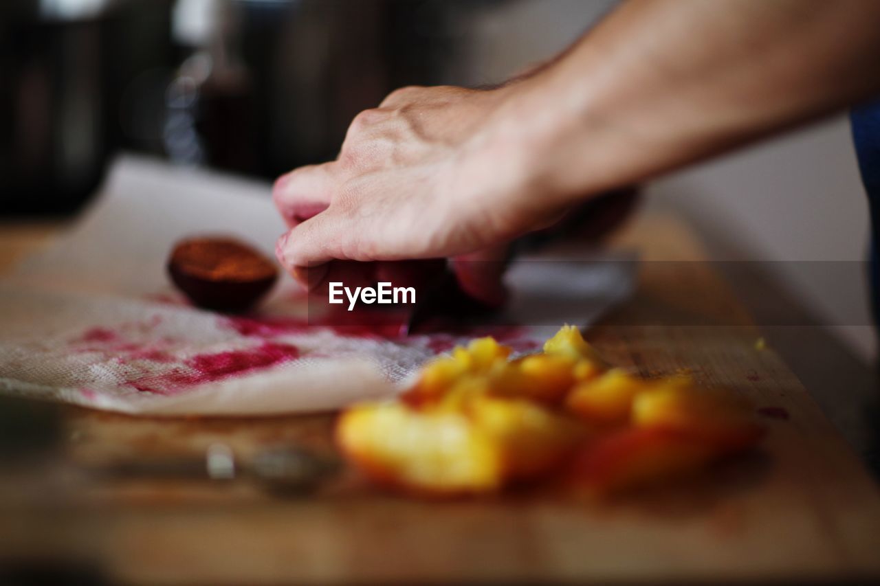 Cropped image of hands preparing food