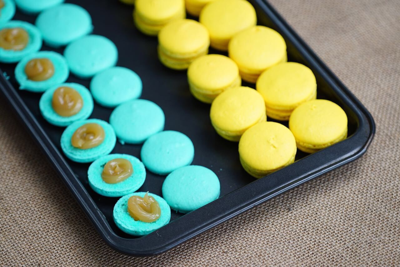 High angle view of macaroons in tray on table
