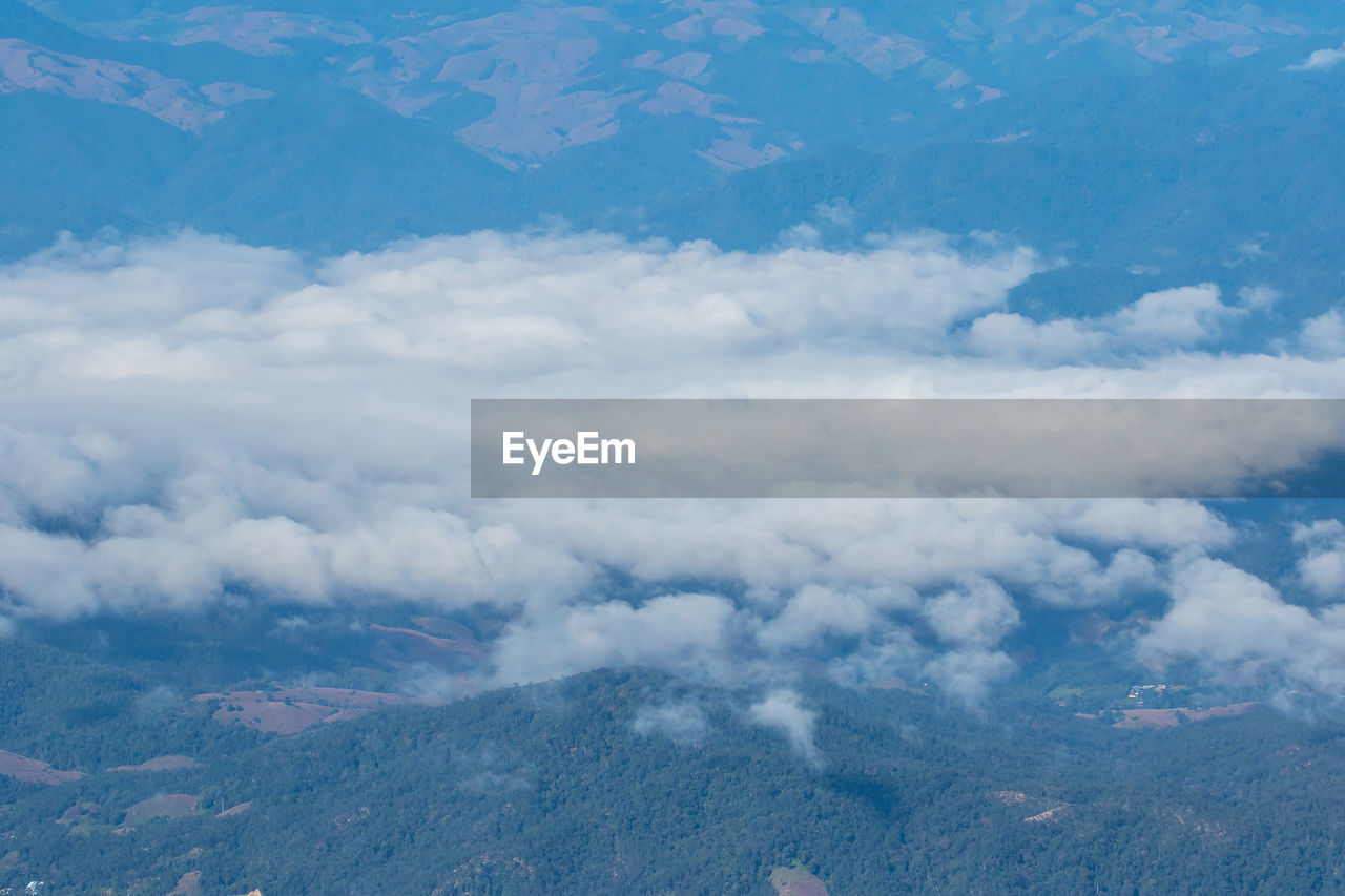 Aerial view of clouds over mountains