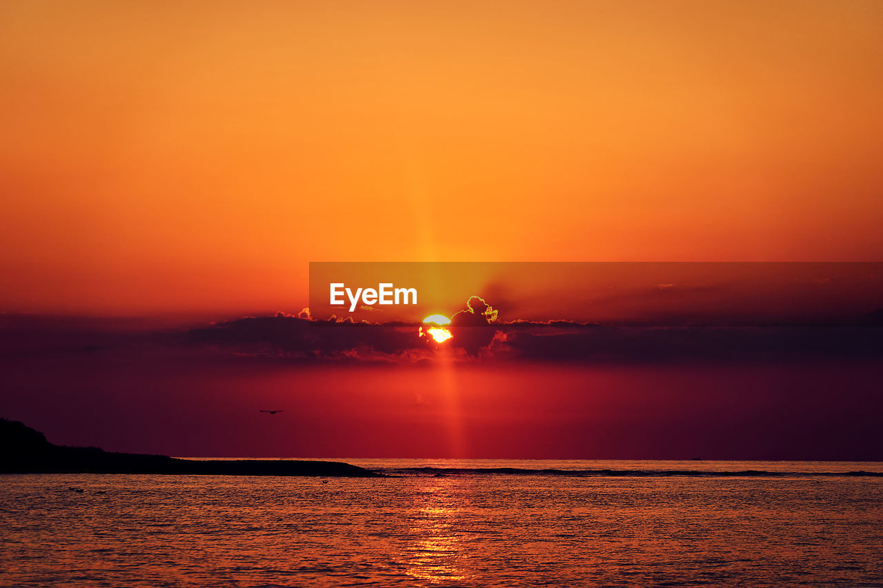 Scenic view of sea against sky during sunset