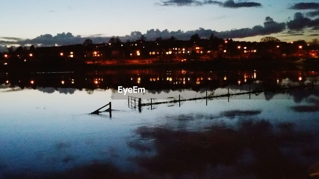 VIEW OF ILLUMINATED CITY AT NIGHT