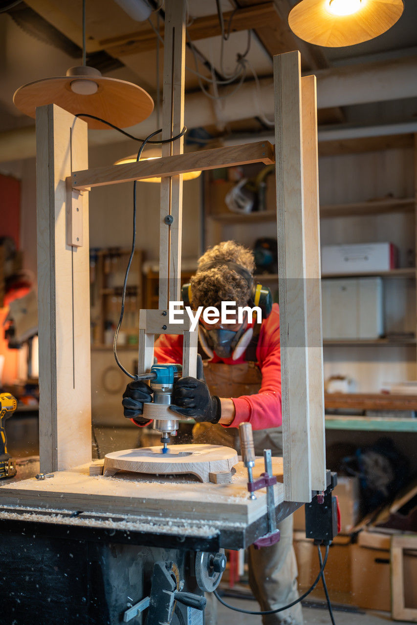 rear view of man working on table