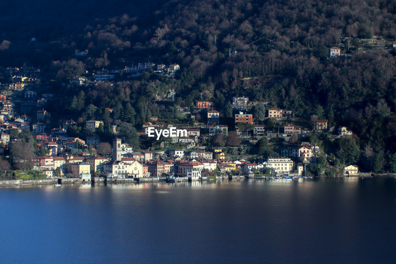 AERIAL VIEW OF TOWNSCAPE BY SEA AGAINST TOWN