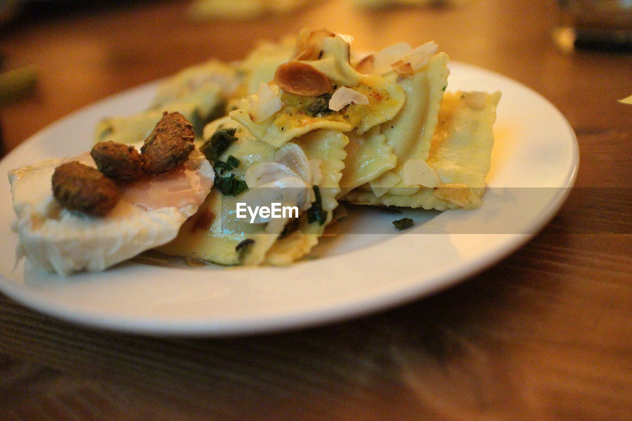 Close-up view of fresh tortellini on white plate