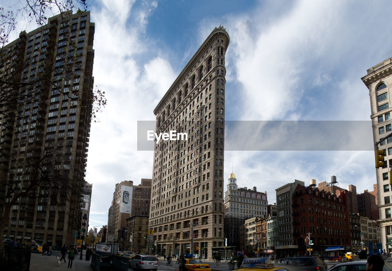 Flatiron building against cloudy sky