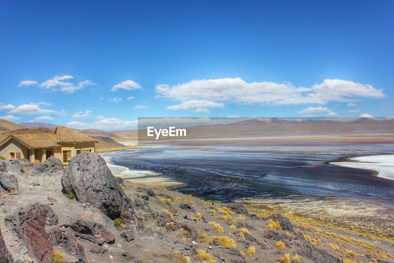 Scenic view of landscape against blue sky