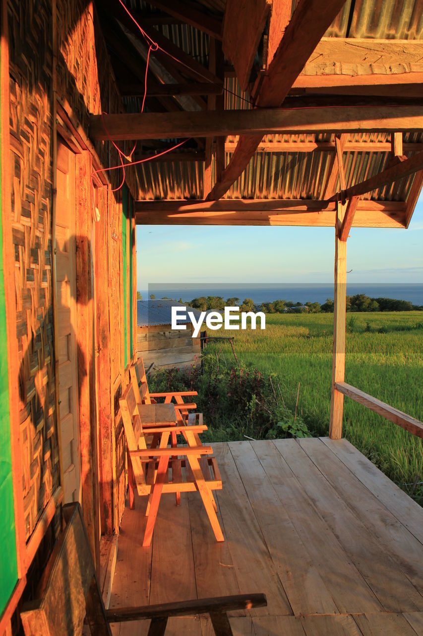 Sunlit porch of holiday house at sunset