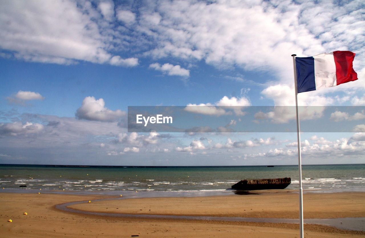 French flag on sandy beach