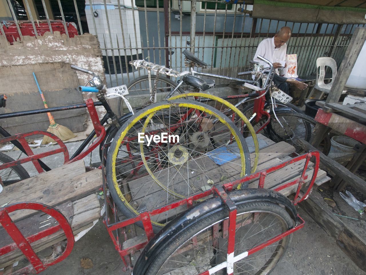 High angle view of abandoned bicycles on cart