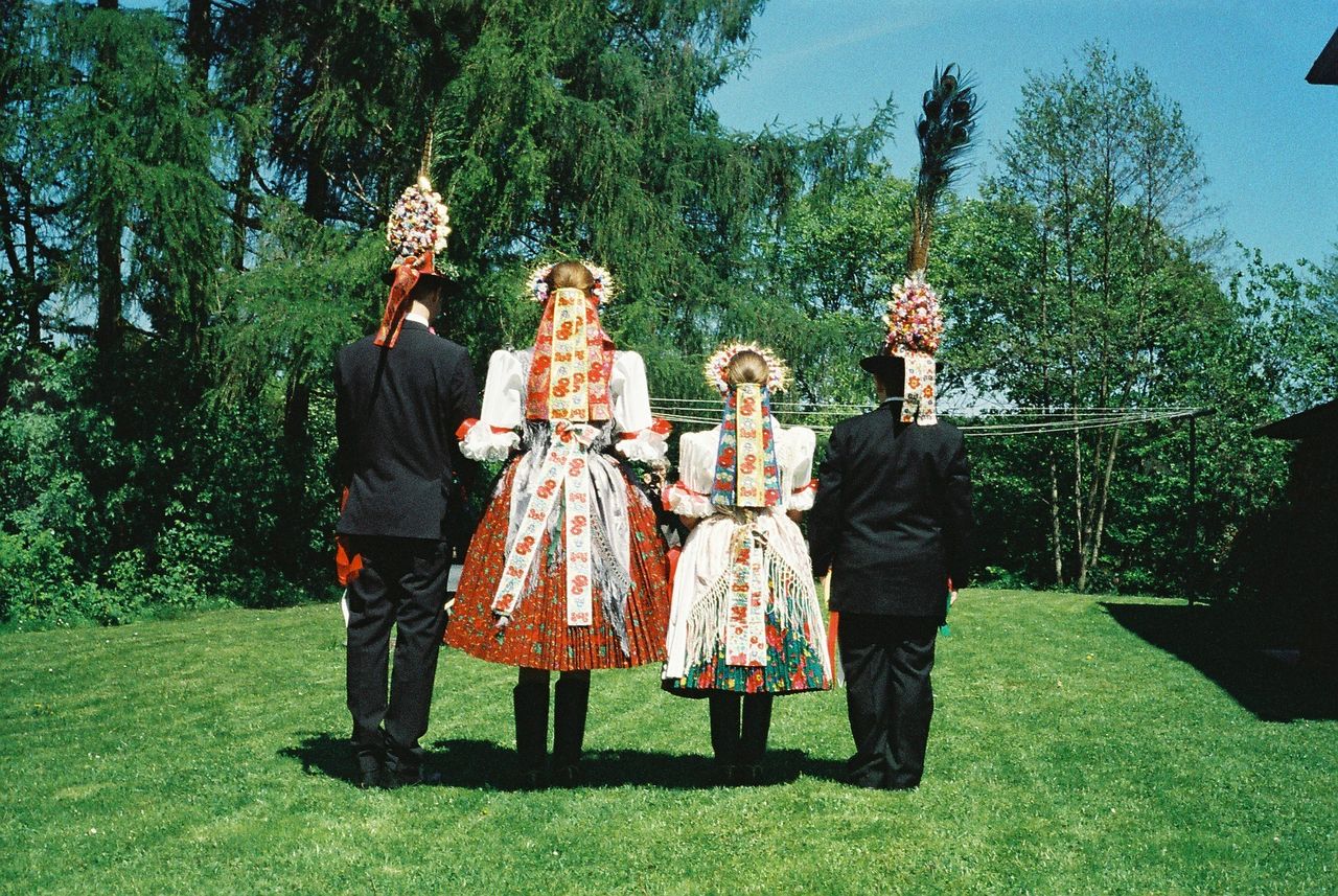 Rear view of people dressed in folk costumes