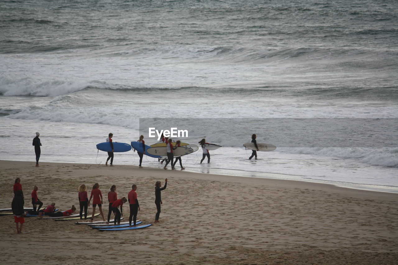 Surfers going to the ocean