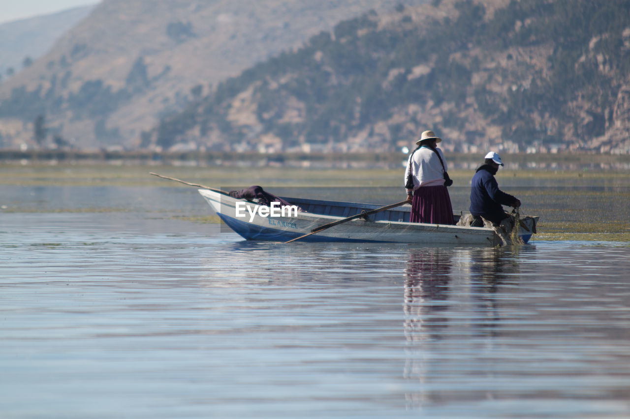 People on a boat in a lake