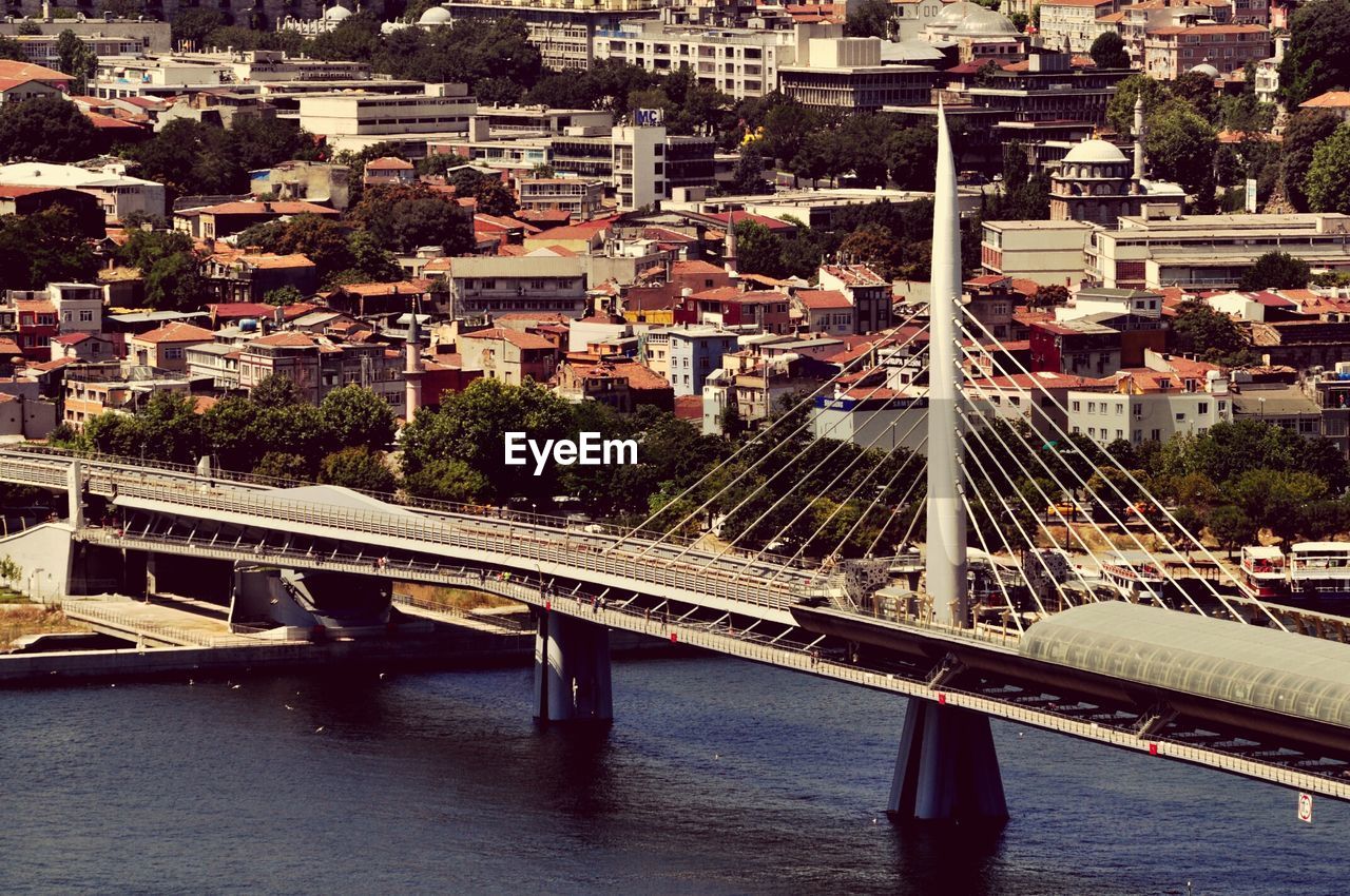 High angle view of golden horn metro bridge over river against cityscape