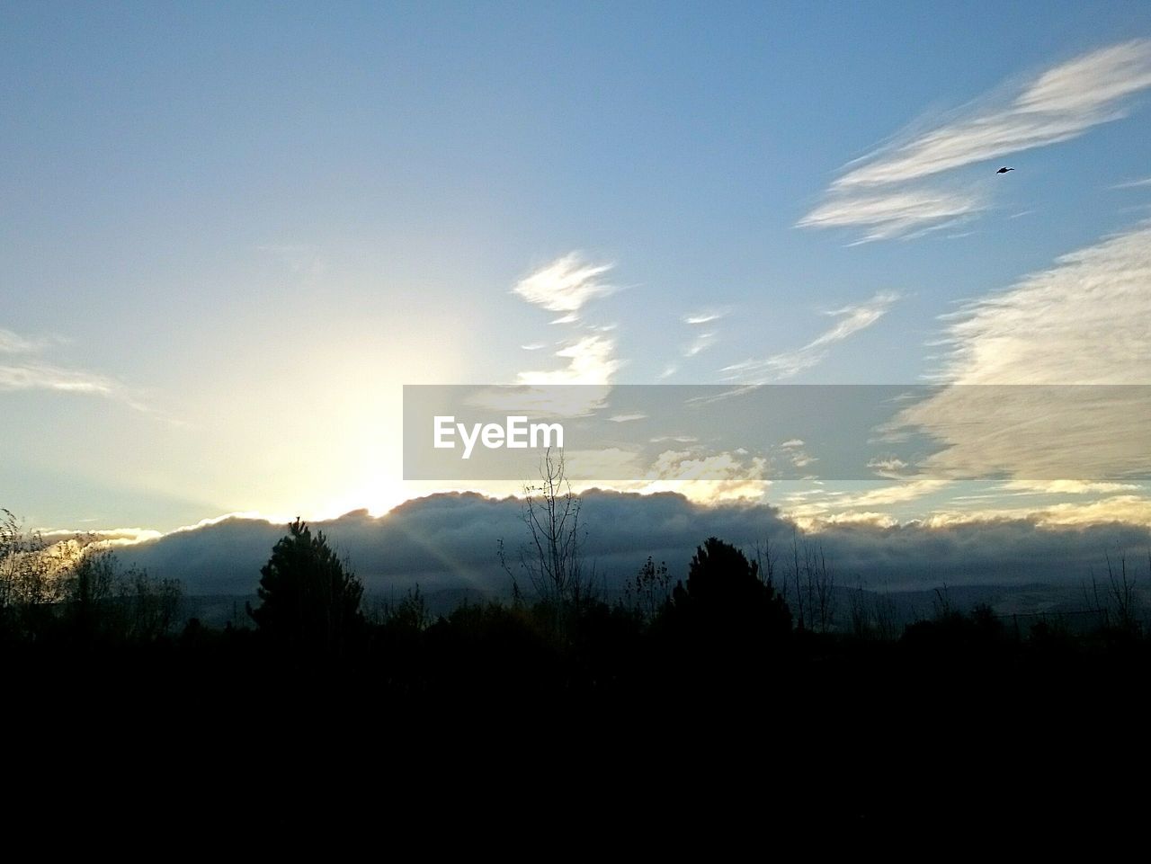 SCENIC VIEW OF MOUNTAINS AT SUNSET