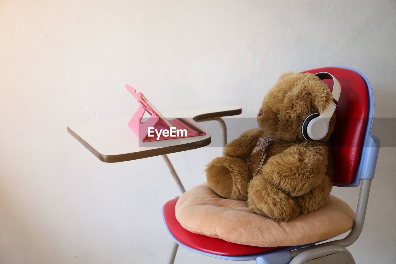 High angle view of stuffed toy on chair