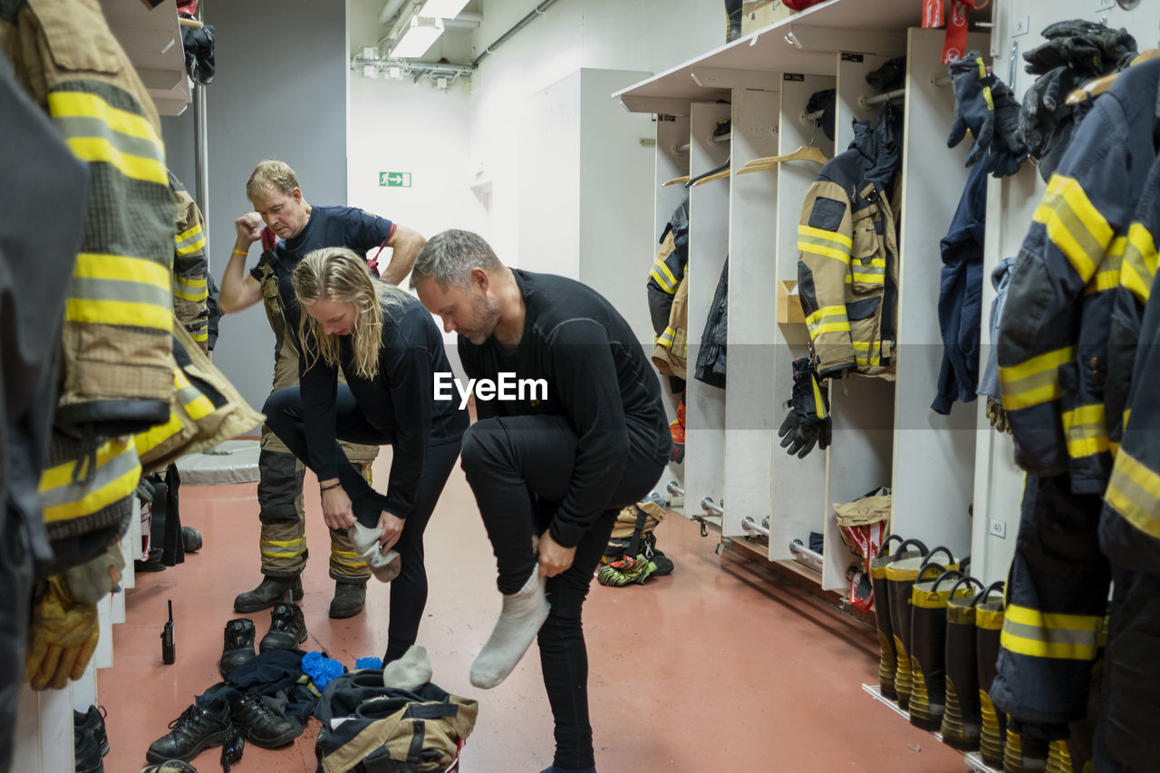 Firefighters changing in locker